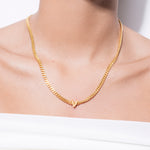 model wearing alphabet necklace with pendant V in gold