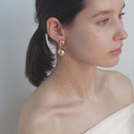 video of model wearing pamela earrings in gold