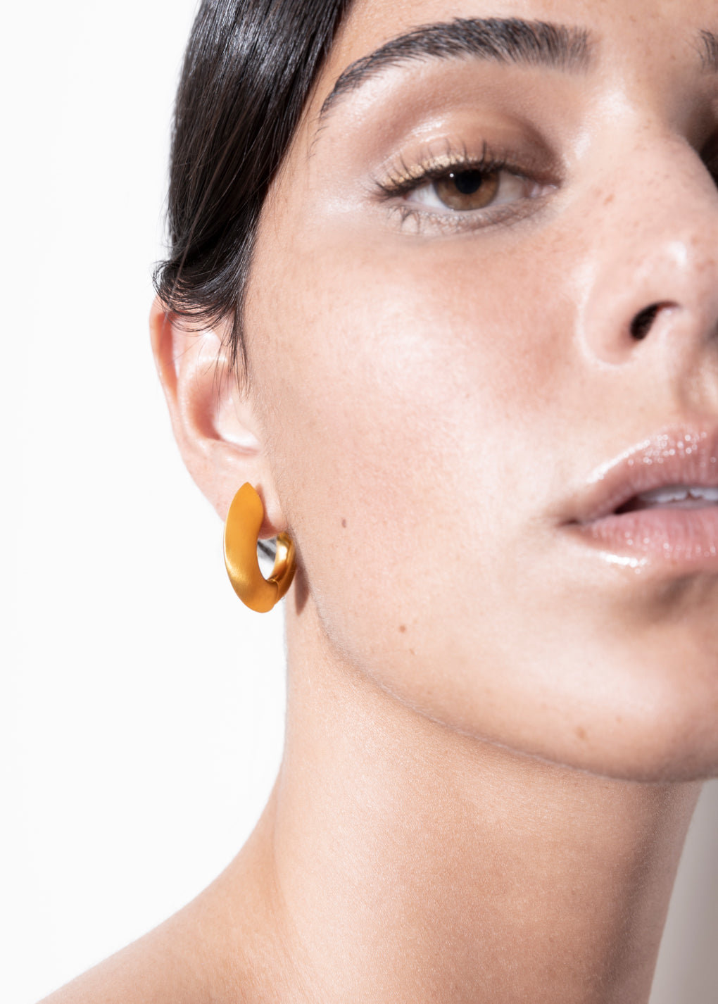 model wearing sarah earrings in gold
