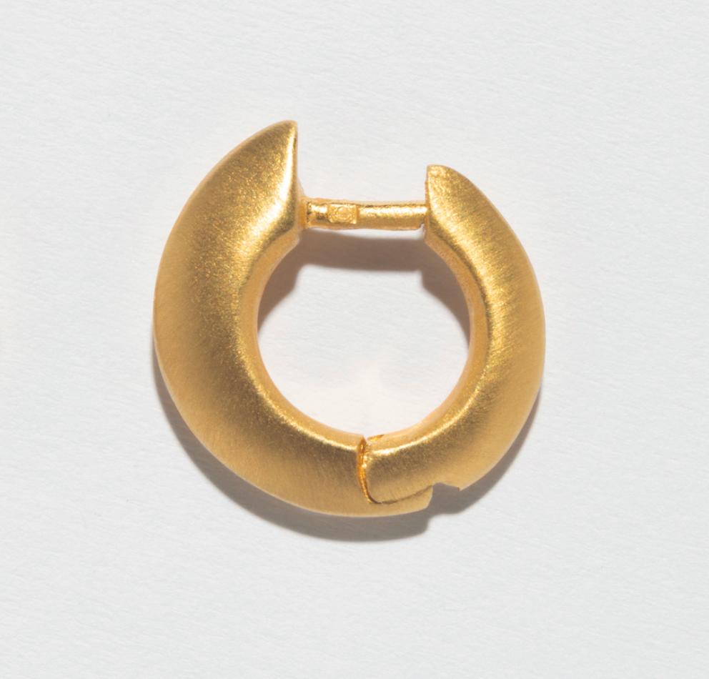 Affordable sterling silver earrings, featuring a stylish gold-plated hoop with a textured finish.