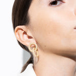 model wearing andreea earrings in gold