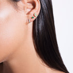model wearing mush stud 18k emerald, balalai stud 18k emerald and cate hoop 18k turquoise