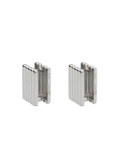 A pair of silver-toned metal radiator-shaped earrings with a ribbed vertical design, shown on a plain white background.