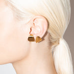 model wearing carly earrings in gold