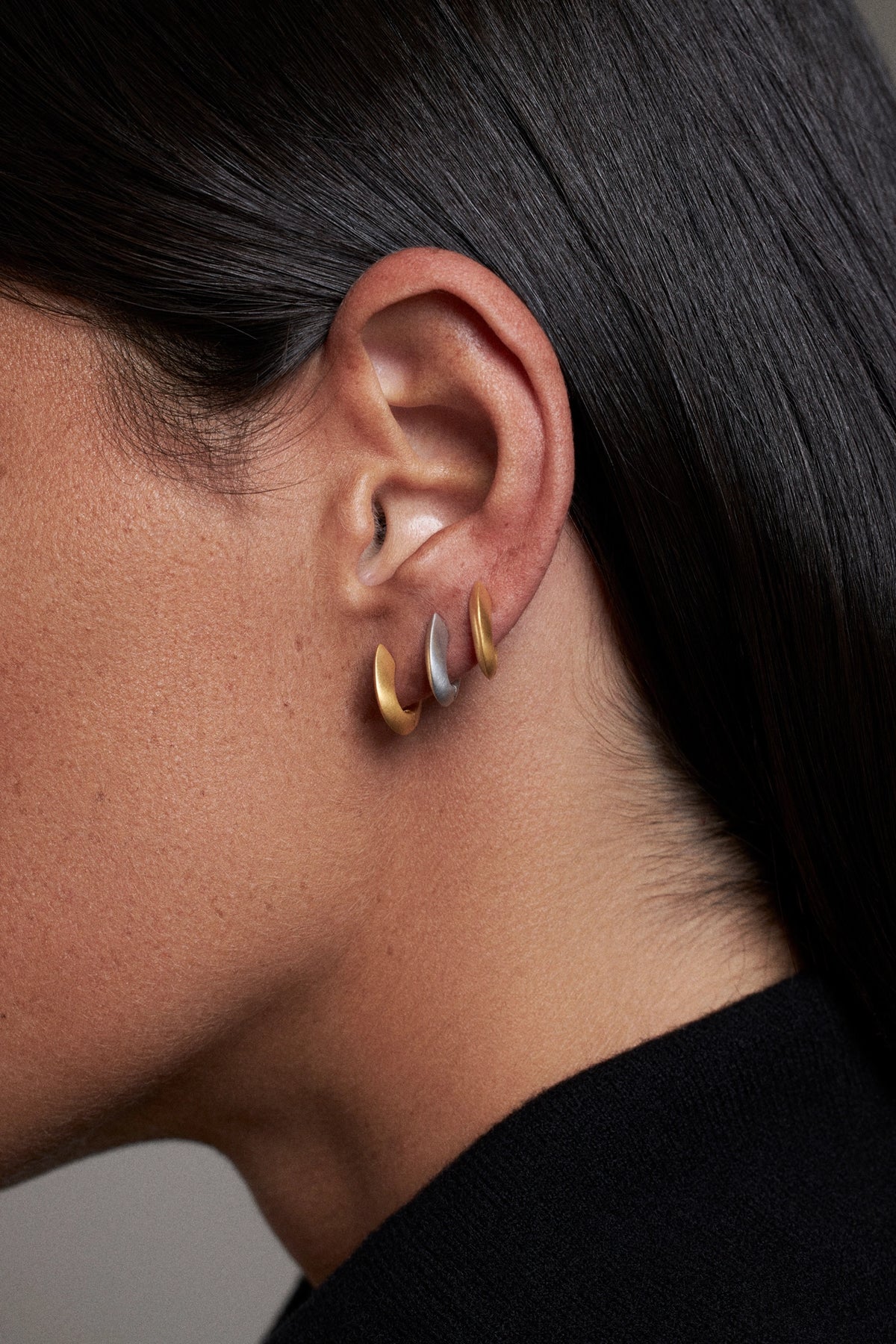 CINCO hoop-earrings-side-view-ear-worn-gold-and-silver-accent