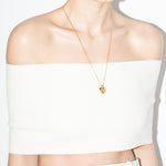 model wearing joan necklace in gold