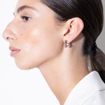 model wearing lizzie earrings in silver