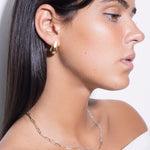 model wearing margo choker in silver, magdalene choker two tone and constantin earrings in gold