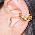 model wearing monet earcuff in gold