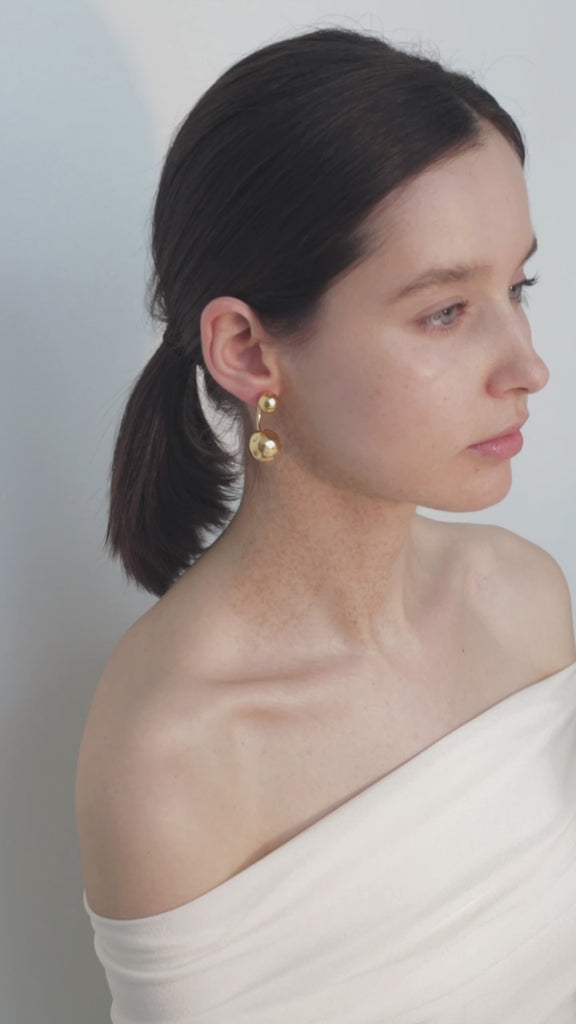 video of model wearing pamela earrings in gold