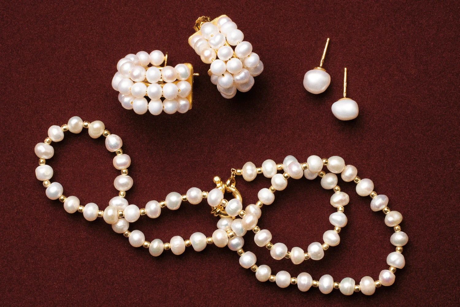 Pearl jewelry on a red background