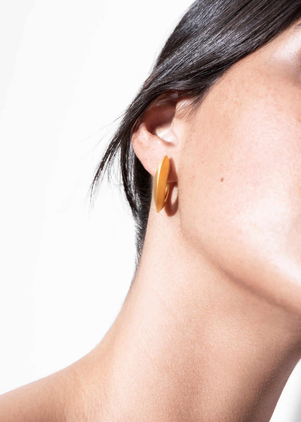 model wearing sarah earrings in gold